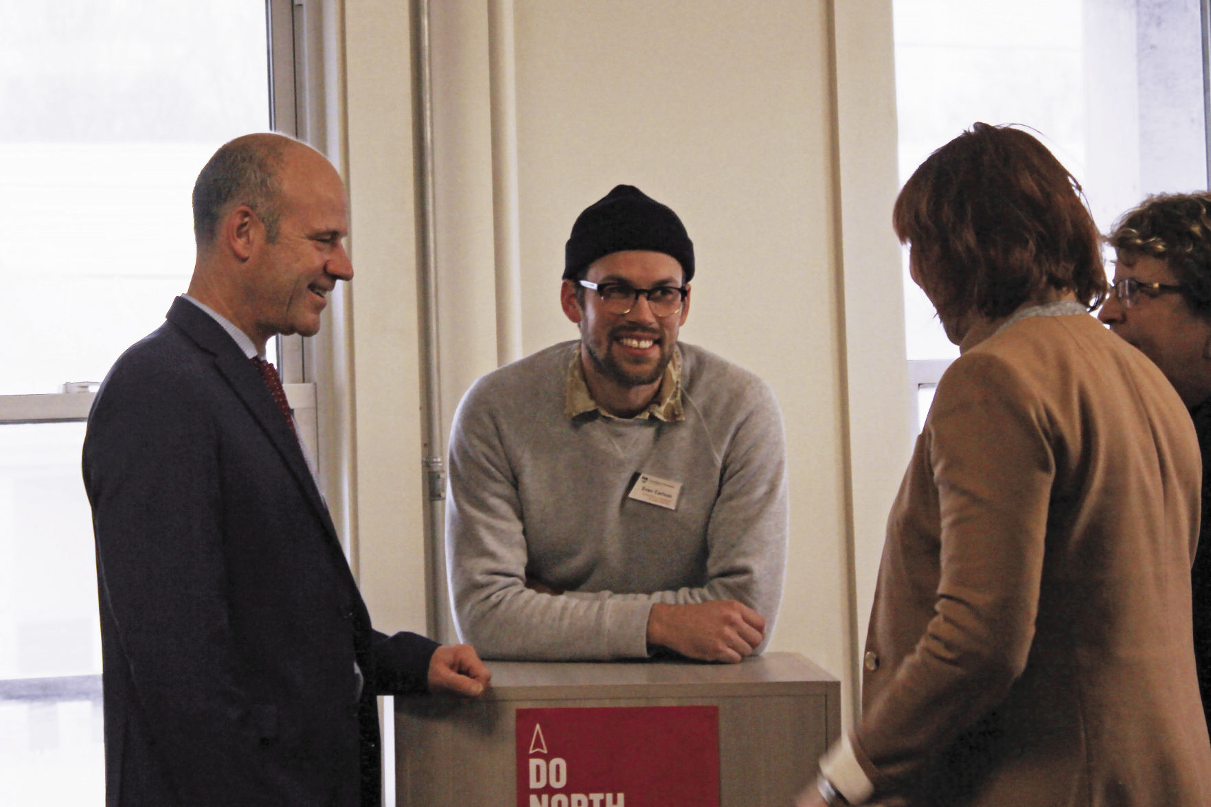 Evan Carlson, Ann Nygard and Bob Morgan, COO of North Country Federal Credit Union chat at the Do North Coworking Launch Party.jpg
